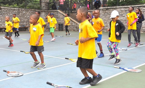 Children Running on Tennis Court