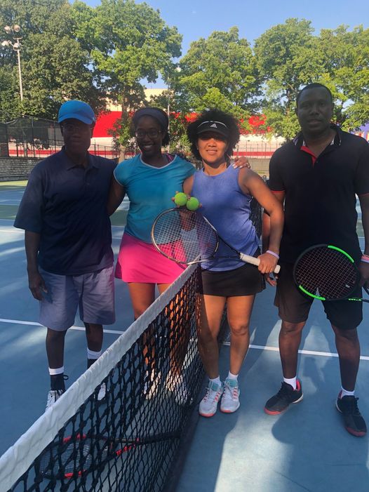 Adults Playing Tennis
